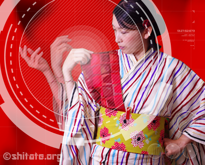 肩に乗ってる帯に手をかける